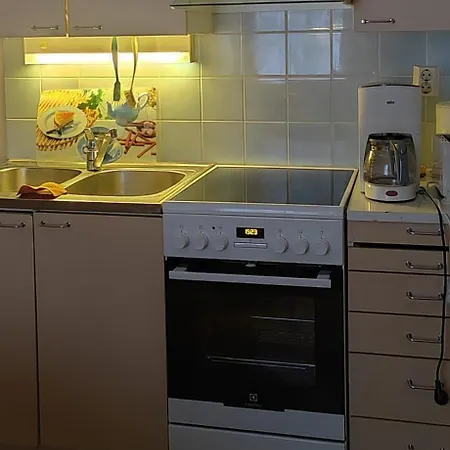 Talo Kainuun Korvessa Kiekinkoskella